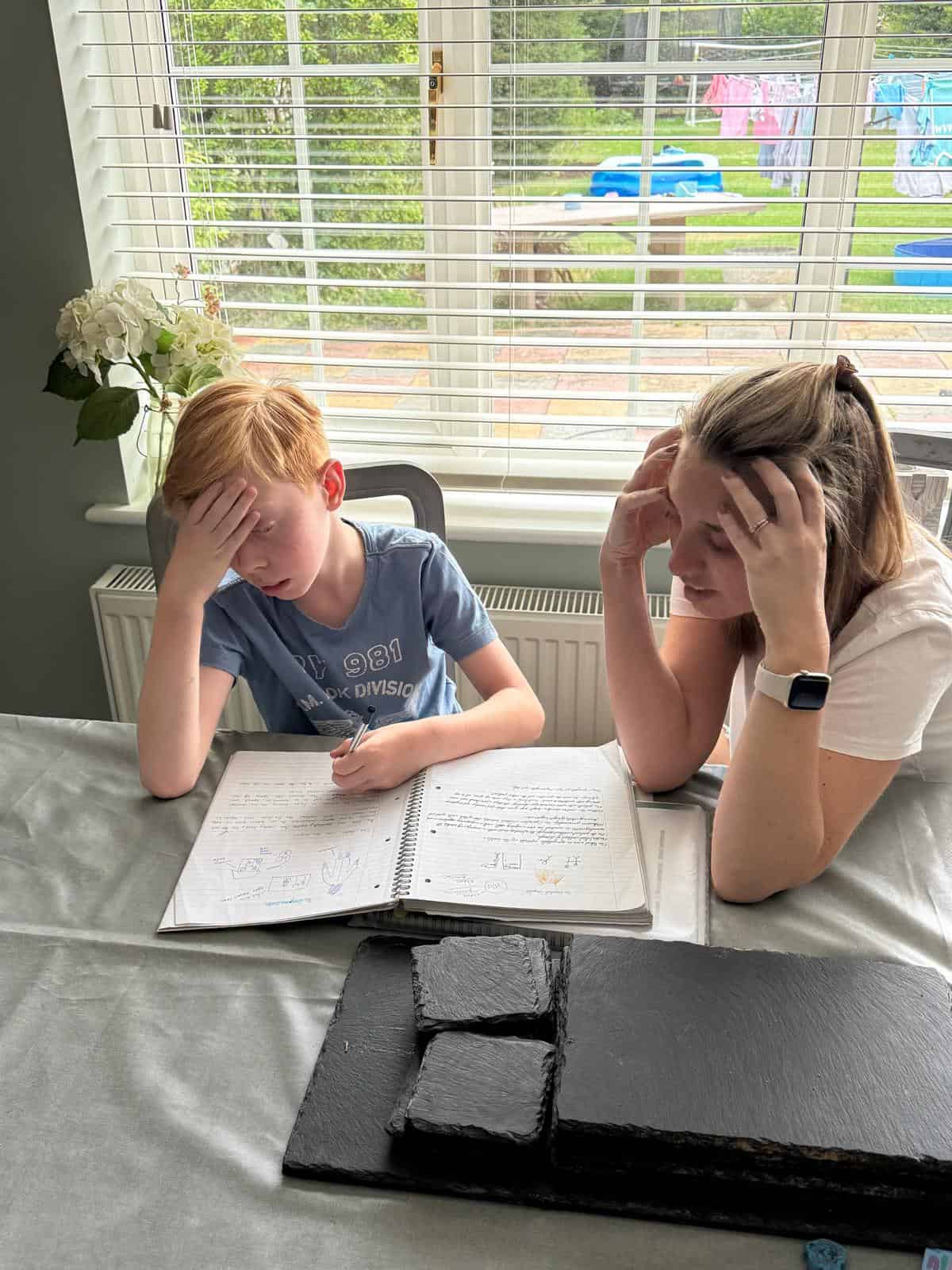 Frustrated parent and child struggling with homework before finding tutoring in Billericay